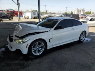 2014 BMW 4 Series 428i with VIN WBA3N3C57EF711803, listed as a Copart auction lot 57856695 with 68,905 mi miles and Salvage title. Bid and sale history available at DreamBid. Image 1.