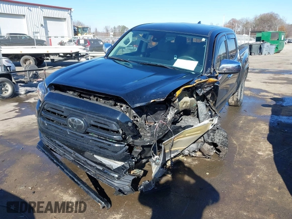2018 Toyota Tacoma SR with VIN 5TFCZ5ANXJX124991, listed as a IAAI auction lot 41136867 with 57,980 mi miles and . Bid and sale history available at carsss.com. Image 6.