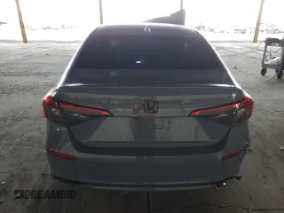 2022 Honda Civic Sport z VIN 2HGFE2F52NH509652, wystawiony jako Copart lot #54934335 z przebiegiem Nie podano mil oraz Szkoda całkowita • Salvage title. Historia ofert i sprzedaży dostępna na DreamBid. Obrazek 6.