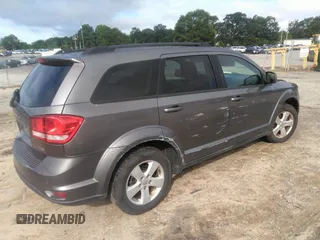 2012 Dodge Journey SXT with VIN 3C4PDCBG9CT153241, listed as a IAAI auction lot 42640265 with 184,719 mi miles and . Bid and sale history available at DreamBid. Image 4.