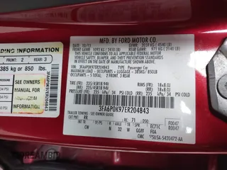 2014 Ford Fusion Titanium with VIN 3FA6P0K97ER204843, listed as a IAAI auction lot 41614434 with 110,165 mi miles. Bid and sale history available at carsss.com. Image 9.