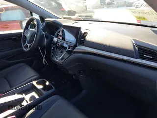 2023 Honda Odyssey Touring with VIN 5FNRL6H80PB005769, listed as a IAAI auction lot 41280858 with 7,041 mi miles and . Bid and sale history available at DreamBid. Image 5.