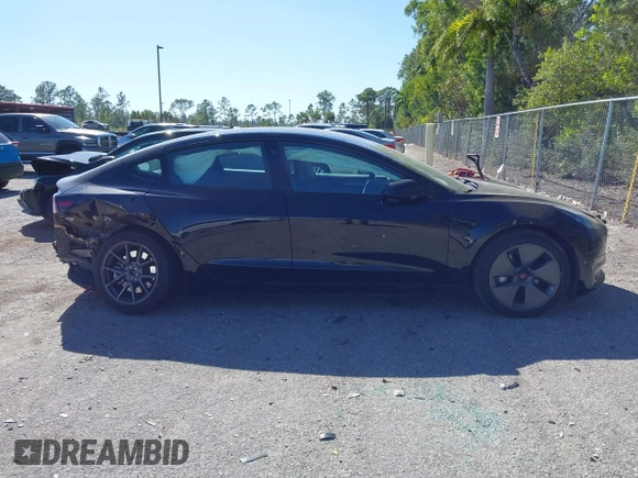 2023 Tesla Model 3 with VIN 5YJ3E1EAXPF623403, listed as a IAAI auction lot 41829543 with 29,414 mi miles and . Bid and sale history available at carsss.com. Image 14.