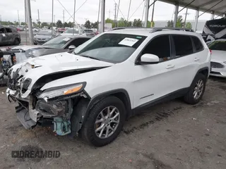2015 Jeep Cherokee Latitude with VIN 1C4PJLCB5FW642701, listed as a IAAI auction lot 42063262 with 142,501 mi miles and . Bid and sale history available at carsss.com. Image 2.