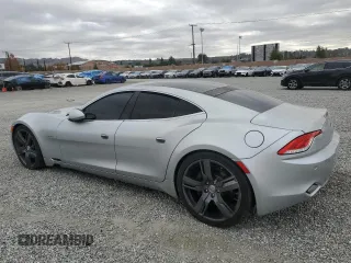 2012 Fisker Karma EcoChic z VIN YH4K16AA0CA000133, wystawiony jako Copart lot #82445934 z przebiegiem 104 427 mil mil oraz Szkody całkowita. Historia ofert i sprzedaży dostępna na DreamBid. Obrazek 2.