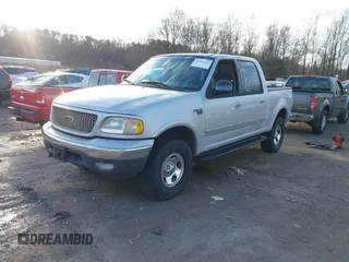 2002 Ford F-150 XLT with VIN 1FTRW08632KE22611, listed as a IAAI auction lot 41519768 with 200,420 mi miles. Bid and sale history available at carsss.com. Image 2.