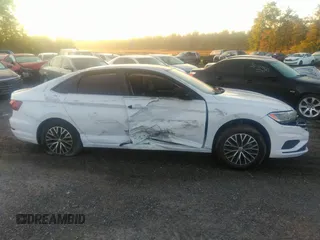 2021 Volkswagen Jetta S z VIN 3VWC57BU1MM017025, wystawiony jako IAAI lot #31656882 z przebiegiem 20 664 mil mil oraz . Historia ofert i sprzedaży dostępna na DreamBid. Obrazek 13.