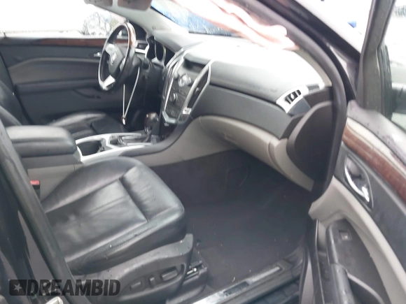 2011 Cadillac SRX Performance Collection with VIN 3GYFNBEYXBS597881, listed as a IAAI auction lot 41016643 with 164,781 mi miles and . Bid and sale history available at carsss.com. Image 5.
