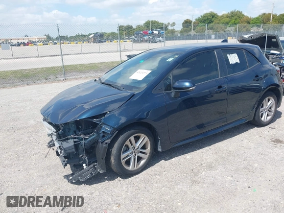 2019 Toyota Corolla Hatchback SE with VIN JTNK4RBE3K3061589, listed as a IAAI auction lot 42123273 with 90,491 mi miles. Bid and sale history available at carsss.com. Image 2.