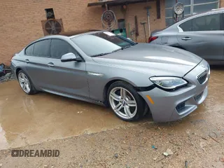 2016 BMW 6 Series 640i xDrive with VIN WBA6D2C58GGT66160, listed as a IAAI auction lot 41130666 with 102,064 mi miles and . Bid and sale history available at carsss.com. Image 1.