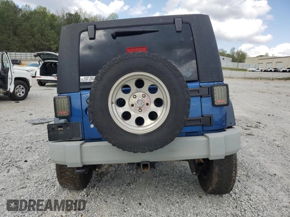 2009 Jeep Wrangler Unlimited Rubicon with VIN 1J4GA69169L762992, listed as a Copart auction lot 51674355 with 147,181 mi miles and Salvage title. Bid and sale history available at DreamBid. Image 6.
