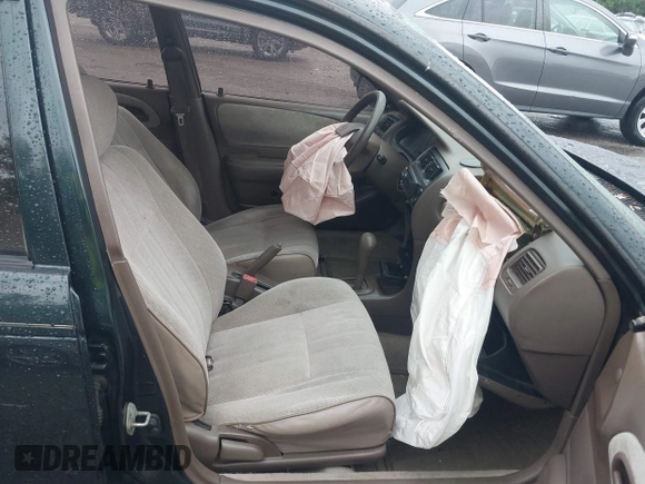 1997 Toyota Corolla with VIN 2T1BA02E2VC211034, listed as a IAAI auction lot 42253359 with 201,451 mi miles and . Bid and sale history available at DreamBid. Image 5.