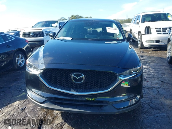 2021 Mazda CX-5 Touring with VIN JM3KFBCM9M0483082, listed as a IAAI auction lot 41305127 with 42,926 mi miles. Bid and sale history available at carsss.com. Image 12.