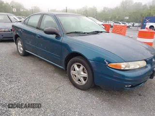 2002 Oldsmobile Alero GL1 z VIN 1G3NL52F32C302234, wystawiony jako IAAI lot #42189960 z przebiegiem 117 596 mil mil oraz . Historia ofert i sprzedaży dostępna na DreamBid. Obrazek 1.