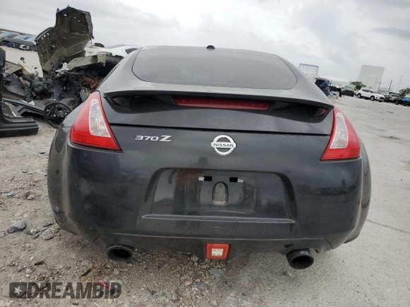2014 Nissan 370Z Nismo z VIN JN1AZ4EH0EM634461, wystawiony jako Copart lot #53375685 z przebiegiem 171 858 mil mil oraz Szkoda całkowita • Salvage title. Historia ofert i sprzedaży dostępna na DreamBid. Obrazek 6.