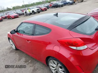 2013 Hyundai Veloster w/Gray Int z VIN KMHTC6AD8DU146035, wystawiony jako IAAI lot #41892703 z przebiegiem 241 169 mil mil oraz . Historia ofert i sprzedaży dostępna na DreamBid. Obrazek 3.