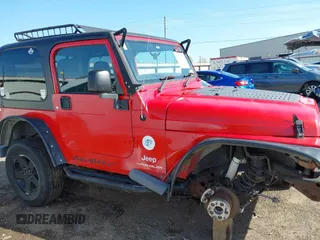 2004 Jeep Wrangler Sport Right Hand Drive with VIN 1J4F449S74P796957, listed as a IAAI auction lot 41987562 with 106,730 mi miles and . Bid and sale history available at carsss.com. Image 13.