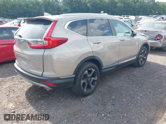2018 Honda CR-V Touring with VIN 5J6RW2H96JL000910, listed as a IAAI auction lot 42490580 with 201,534 mi miles and . Bid and sale history available at DreamBid. Image 4.