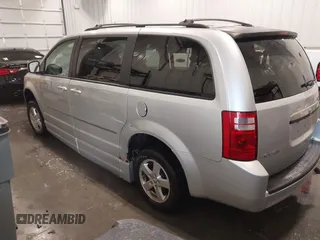 2010 Dodge Grand Caravan SXT with VIN 2D4RN5D15AR261319, listed as a IAAI auction lot 41877022 with 142,292 mi miles and . Bid and sale history available at DreamBid. Image 3.