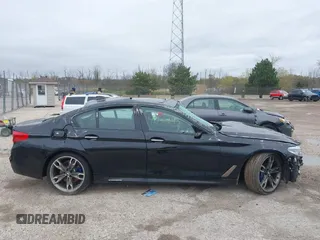 2018 BMW 5 Series M550i xDrive with VIN WBAJB9C56JB286742, listed as a IAAI auction lot 42176643 with 61,445 mi miles and . Bid and sale history available at DreamBid. Image 14.