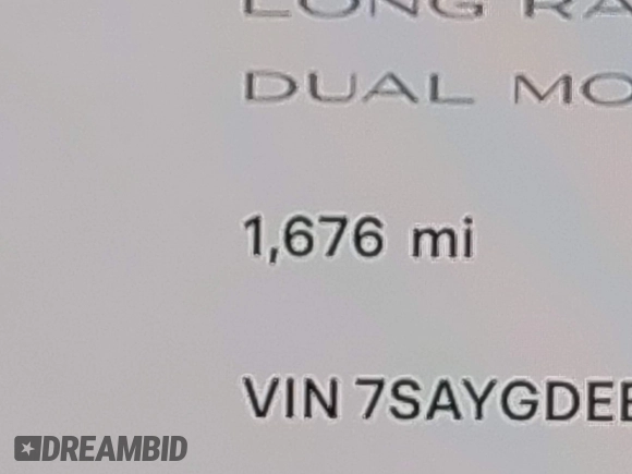 2025 Tesla Model Y Long Range with VIN 7SAYGDEE2SA337378, listed as a IAAI auction lot 41940840 with 1,676 mi miles and . Bid and sale history available at DreamBid. Image 15.