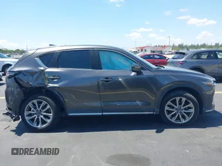 2018 Mazda CX-5 Grand Touring with VIN JM3KFADM8J1310328, listed as a IAAI auction lot 42322780 with 106,378 mi miles and . Bid and sale history available at DreamBid. Image 14.