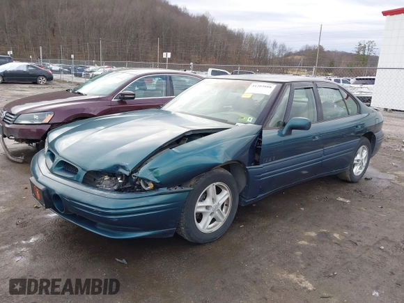 1996 Pontiac Bonneville z VIN 1G2HZ5210TH210829, wystawiony jako IAAI lot #41203888 z przebiegiem 154 990 mil mil oraz . Historia ofert i sprzedaży dostępna na DreamBid. Obrazek 17.