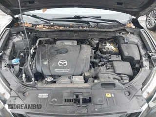 2014 Mazda CX-5 Grand Touring with VIN JM3KE4DY0E0392476, listed as a IAAI auction lot 41419144 with 89,245 mi miles and . Bid and sale history available at carsss.com. Image 10.