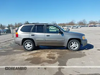 2005 GMC Envoy SLE z VIN 1GKDT13S252331044, wystawiony jako IAAI lot #41749219 z przebiegiem 263 876 mil mil oraz . Historia ofert i sprzedaży dostępna na DreamBid. Obrazek 14.