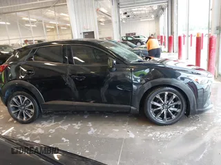 2019 Mazda CX-3 Touring z VIN JM1DKDC70K0404219, wystawiony jako IAAI lot #42148454 z przebiegiem 80 539 mil mil oraz . Historia ofert i sprzedaży dostępna na DreamBid. Obrazek 13.