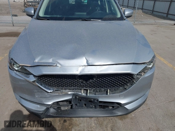 2019 Mazda CX-5 Sport with VIN JM3KFBBM6K1582760, listed as a IAAI auction lot 41822152 with 60,620 mi miles and . Bid and sale history available at DreamBid. Image 6.