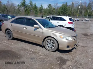 2011 Toyota Camry LE with VIN 4T1BF3EKXBU764478, listed as a IAAI auction lot 42180243 with 122,748 mi miles and . Bid and sale history available at carsss.com. Image 1.