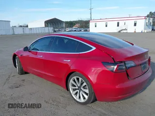 2019 Tesla Model 3 Mid Range with VIN 5YJ3E1EA3KF466418, listed as a IAAI auction lot 41724564 with 53,774 mi miles and . Bid and sale history available at DreamBid. Image 3.