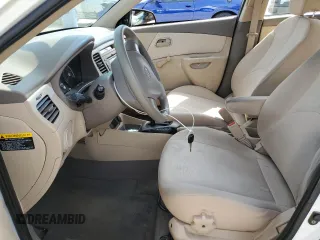 2009 Kia Rio LX with VIN KNADE223896456292, listed as a Copart auction lot 54990605 with 61,220 mi miles and Salvage Title. Bid and sale history available at DreamBid. Image 7.