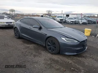 2021 Tesla Model S Long Range with VIN 5YJSA1E51MF440929, listed as a IAAI auction lot 41144902 with Not provided miles and . Bid and sale history available at DreamBid. Image 1.
