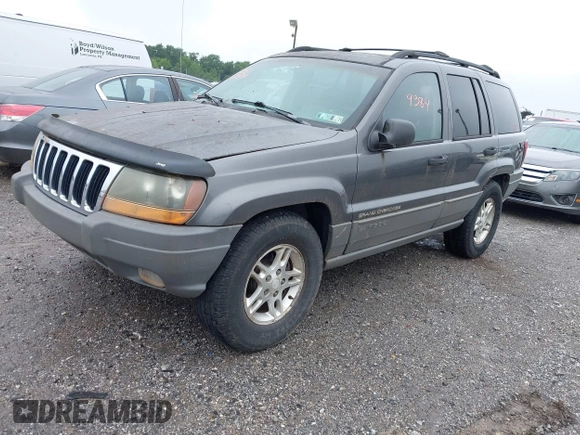 2002 Jeep Grand Cherokee with VIN 1J4GW38N62C190851, listed as a IAAI auction lot 42519384 with 142,066 mi miles and . Bid and sale history available at DreamBid. Image 2.