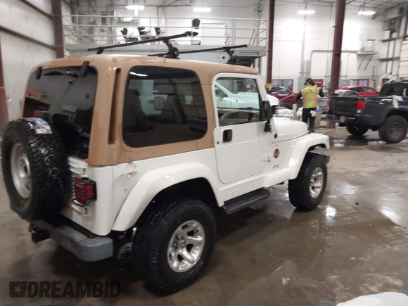 1997 Jeep Wrangler Sahara with VIN 1J4FY49S3VP529837, listed as a IAAI auction lot 41752978 with 138,024 mi miles. Bid and sale history available at carsss.com. Image 4.
