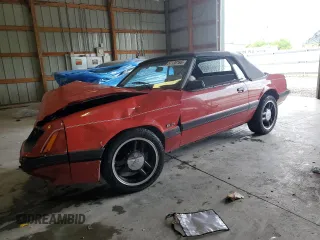 1985 Ford Mustang with VIN 1FABP27M9FF191860, listed as a Copart auction lot 57130165 with 67,427 mi miles and Salvage title. Bid and sale history available at DreamBid. Image 1.