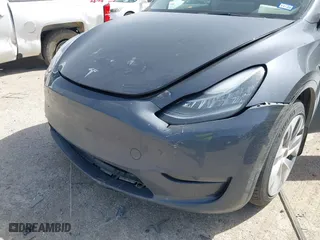 2023 Tesla Model Y Long Range with VIN 7SAYGDEE5PA035722, listed as a IAAI auction lot 41726067 with 34,357 mi miles. Bid and sale history available at carsss.com. Image 6.