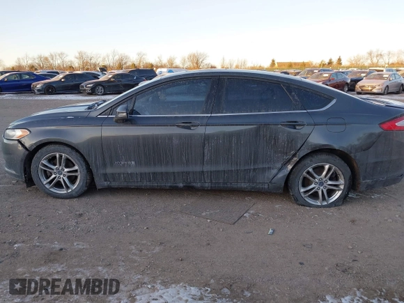 2015 Ford Fusion SE Hybrid with VIN 3FA6P0LU1FR219908, listed as a IAAI auction lot 41272688 with 310,452 mi miles. Bid and sale history available at carsss.com. Image 15.