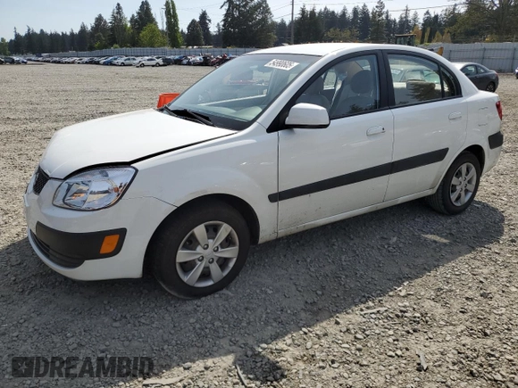 2009 Kia Rio LX with VIN KNADE223896456292, listed as a Copart auction lot 54990605 with 61,220 mi miles and Salvage Title. Bid and sale history available at DreamBid. Image 1.