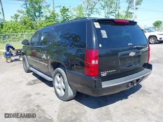 2011 Chevrolet Suburban LTZ with VIN 1GNSCKE01BR275919, listed as a IAAI auction lot 42038399 with 247,841 mi miles. Bid and sale history available at carsss.com. Image 3.