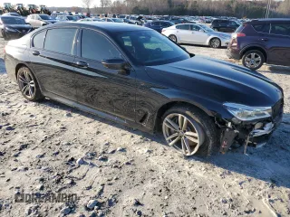 2016 BMW 7 Series 750i with VIN WBA7F0C5XGGL99048, listed as a Copart auction lot 84815364 with 96,743 mi miles and Salvage Title. Bid and sale history available at carsss.com. Image 4.