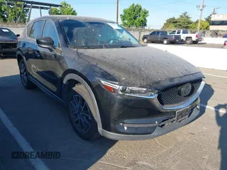 2018 Mazda CX-5 Grand Touring with VIN JM3KFBDM1J0345014, listed as a IAAI auction lot 42703926 with 151,453 mi miles and . Bid and sale history available at DreamBid. Image 1.