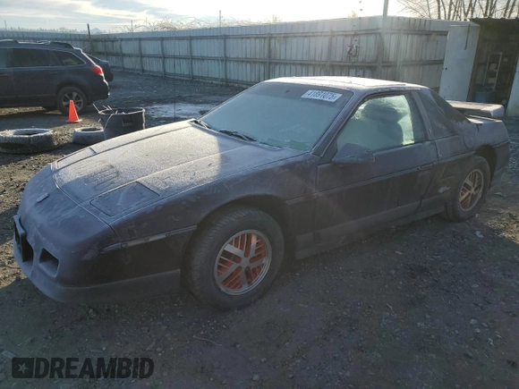 1986 Pontiac Fiero z VIN 1G2PF3793GP210763, wystawiony jako Copart lot #41891075 z przebiegiem 144 219 mil mil oraz Czysty tytuł • Clean title. Historia ofert i sprzedaży dostępna na DreamBid. Obrazek 1.