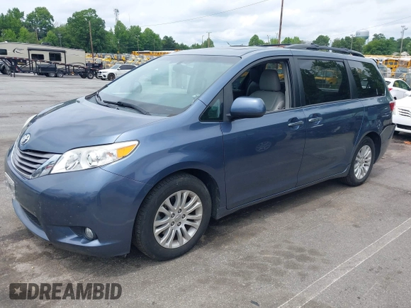 2015 Toyota Sienna XLE with VIN 5TDYK3DC3FS676919, listed as a IAAI auction lot 42475307 with 99,574 mi miles and . Bid and sale history available at DreamBid. Image 2.