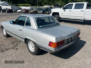 1984 Mercedes-Benz SL with VIN WDB1070421A009542, listed as a Copart auction lot 65327125 with 142,656 mi miles and Clean title. Bid and sale history available at DreamBid. Image 3.