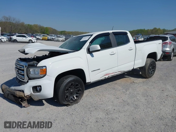 2019 GMC Canyon 4WD SLE z VIN 1GTG6CEN0K1353094, wystawiony jako IAAI lot #42065160 z przebiegiem 73 235 mil mil oraz . Historia ofert i sprzedaży dostępna na DreamBid. Obrazek 17.