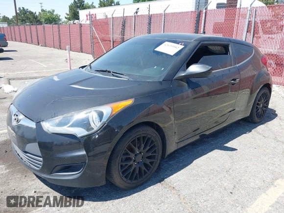 2013 Hyundai Veloster w/Black Int with VIN KMHTC6AD4DU151409, listed as a IAAI auction lot 42639582 with 283,208 mi miles and . Bid and sale history available at DreamBid. Image 2.