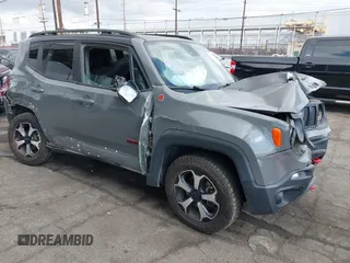 2021 Jeep Renegade Trailhawk z VIN ZACNJDC10MPM34625, wystawiony jako IAAI lot #42116576 z przebiegiem 74 883 mil mil oraz . Historia ofert i sprzedaży dostępna na DreamBid. Obrazek 1.